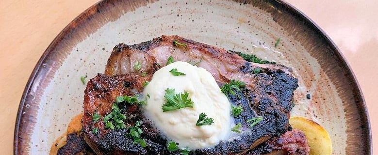 The Curious Pig’s Signature Pork Chop