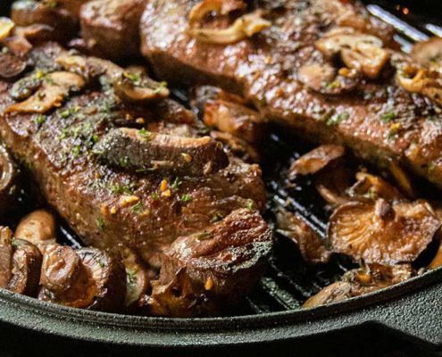 Cast Iron Seared Strip Steaks with Sautéed Wild Mushrooms
